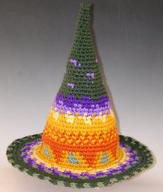 Judy has made these one of a kind Witch Hats for the pure joy of it for years. These are her evening projects to relax and have fun with color and pattern, her two loves! This design is made custom for you, you just select and send a color pallet and turn her loose. Check the stitch detail on these. Judy uses a tight uniform stitch to create a firm hat that stands on its own. She includes a soft wire in the edge so you can sculpt the brim to fit your mood. Each hat is unique, and average over 80 Fun Multicolor Costume Hat, Custom Multicolor Hat With Curved Brim, Fun Multicolor Costume Hats And Headpieces, Playful Multicolor Costume Hats, Multicolor Mini Hat With Curved Brim, Multicolor Mini Hats With Curved Brim, Custom Multicolor Brimmed Hat, Whimsical Handmade Multicolor Crochet Hat, Whimsical Multicolor Handmade Crochet Hat