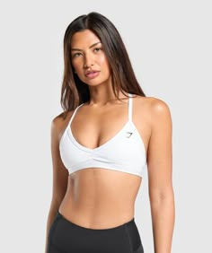 FOR YOU, FOR YOURS When you work out, you need total comfort. So for sports bras with zero distractions, lasting comfort and designs to mix and match with any of your other pieces, look no further that here. These designs are made for you, and for yours. - Low support- Low coverage- Halter silhouette achieved with easy strap removal- Personalise by mixing and matching the removable bra straps- Gymshark logo to front- 78% Polyester, 22% Elastane- Model is 5'8" and wears a size XS- SKU: B3A2J-WBBM Gym Shark Sport Bras, Gym Shark Bra, Gym Wishlist, Gymshark Minimal, Sports Bras For Big Busts, Gymshark Bra, Gym Shark Outfit, Black Friday Shopping List, Running Outfits