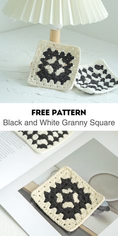 a crocheted lamp shade with black and white granny square on it, sitting next to an open book