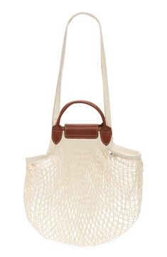 Leather handles bring a sophisticated twist to this knit shopping bag that facilitates a waste-free lifestyle. Style Name:Longchamp Le Pliage Filet Knit Shoulder Bag. Style Number: 6180834. White Top Handle Crochet Bag For Shopping, Beige Hobo Bag With Rolled Handles For Shopping, Cream Bucket Bag With Top Carry Handle For Shopping, White Shoulder Bag With Rolled Handles For Errands, Long Handle Shoulder Bag With Braided Handles, Beige Crochet Bag With Round Handle For Shopping, Beige Bucket Bag With Round Handle For Shopping, Beige Satchel With Rolled Handles For Shopping, White Shoulder Bag With Rolled Handles For Shopping