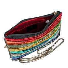 A stunning array of rainbow bead strands adorn the front of this crossbody handbag for a colorful and vibrant look that not only adds a playful movement to your style, but also exudes a passionate and energetic vibe.Product Deatails 10" x 1" x 7" Strap Length End to End: 49" Strap Drop: 23" Removable crossbody chain strap, zipper closure, inside pocket, back pocket, metal logo fob, protective storage bag, certificate of authenticity, fits a phone, leather back This is a handmade item, each one a Multicolor Crossbody Shoulder Bag For Party, Multicolor Crossbody Shoulder Bag For Evening, Multicolor Crossbody Clutch For Evening, Multicolor Beaded Crossbody Shoulder Bag, Multicolor Crossbody Clutch For Party, Multicolor Beaded Shoulder Bag, Multicolor Shoulder Bag Clutch For Party, Rainbow Rectangular Bag For Parties, Evening Bags With Colorful Beads In Multicolor