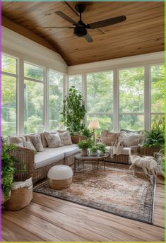 a sun room with couches, tables and plants in it's centerpiece