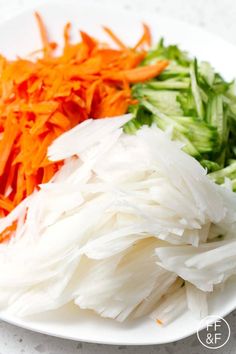 chopped carrots and celery on a white plate