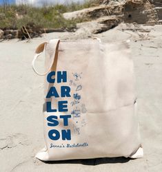 a bag sitting on top of a sandy beach