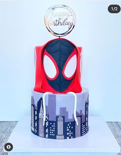 a birthday cake with a spiderman design on it