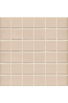 a beige tile wall with white tiles on it