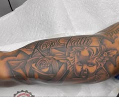 a man's arm with tattoos on it and the words leo faith above him