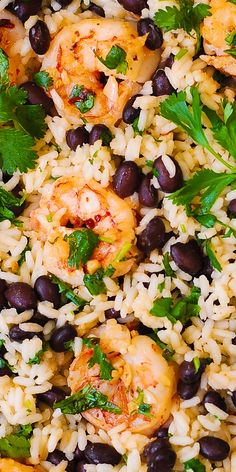 rice and black beans are mixed together in a skillet with shrimp, cilantro, and parsley