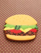 a cookie shaped like a hamburger sitting on top of a table