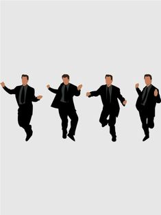 four men in suits and ties are running