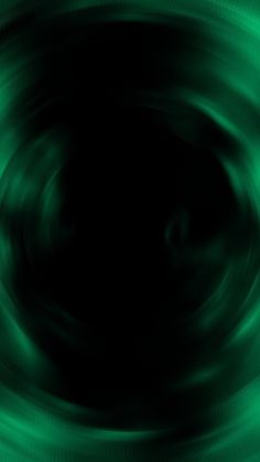 an abstract green background with black and white swirls in the bottom right hand corner