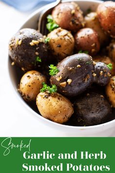 garlic and herb smoked potatoes in a white bowl