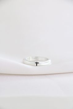 These rings are hand sculpted and handcast from fine sterling silver. Ring is stamped with a simple cross... wear one or stack a few. Such a simple ring with so much meaning. Listing is for one ring. These are not machine made. Sterling silver metal is epoxy free and tarnish resistant. We are not able to stamp the inside of the ring. If you would like something in addition to the cross, you can leave those personalization details at checkout. Please note there is a 12 character maximum. View our Spiritual Promise Rings With Engraving Option, Spiritual Engraved Ring For Promise With Polished Finish, Adjustable Sterling Silver Signet Ring For Promise, Sterling Silver Engraved Ring With Polished Finish For Promise, White Sterling Silver Signet Ring For Wedding, Wedding White Sterling Silver Signet Ring, Symbolic Sterling Silver Stackable Promise Rings, Sterling Silver Engraved Promise Ring, Open Design, Engraved Sterling Silver Promise Ring