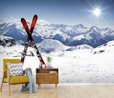 there is a wall mural with skis on it in the living room and mountain view