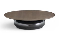 an oval wooden table with metal base