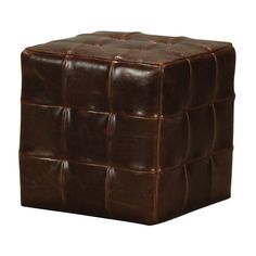 a square brown leather ottoman sitting on top of a white floor