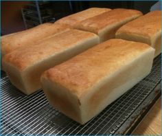 four pieces of bread sitting on top of a cooling rack