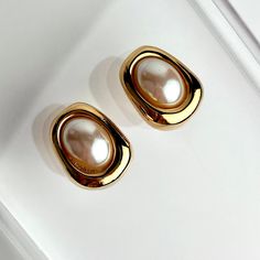 Vintage 90s Bijoux Givenchy Earrings Glass Pearl Polished Gold Plated Modernist Minimalist Clip On SIGNED. Gorgeous Vintage 90s Bijoux Givenchy Clip On Earrings. A Minimalist Aesthetic By Givenchy. These Lovely Earrings Feature A Unique Modernist Shape Finished In Polished Gold Plating. An Oval Shaped Glass Pearl Sits Center. Made Of Gold Plating With Classic Clip On Style Backs. Givenchy Always Does It Right. A Perfect Classic Earring To Compliment Your Wardrobe Looks. These Are Beautiful Earrings. SIGNED Preowned Vintage Condition. Shows Signs Of Lite To Mild Vintage Wear Primarily Some Surface Wear, Lite Scratches Or Marks. Great Vintage Condition. 90s Minimalist Aesthetic, Minimalist Metal Clip-on Earrings For Formal Occasions, Elegant Rectangular Clip-on Earrings For Formal Events, Elegant Gold Rectangular Clip-on Earrings, Classic Metal Clip-on Earrings For Evening, Givenchy Earrings, Classic Earrings, Lovely Earrings, Minimalist Aesthetic