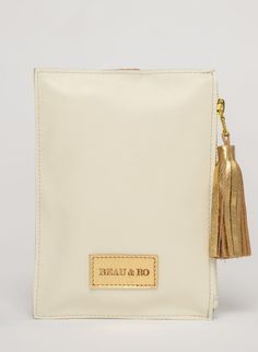 This bag is made from high-quality, super-soft ivory leather sourced from a premiere hide house in California. The leather is shipped to New York City, where our bags are produced by expert craftsmen and finished with a smooth zipper, leather tassel, and metal ring. Just big enough for all your essentials, we designed the Ring Wristlet to be your go-to bag for going out! Whether you’re heading to a cocktail party, a concert, or out on the town, slip it on your wrist so your hands are free for si Chic Cream Bag With Interior Card Slots, Luxury White Pouch For Daily Use, Beige Leather Clutch, Soft Leather Beige Clutch, Beige Soft Leather Clutch, Luxury Cream Rectangular Pouch, Beige Leather Clutch With Zipper Closure, Luxury Cream Leather Clutch, Luxury Beige Bags With Zipper Pouch