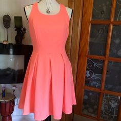 Bright Neon Peachy/Orange Dress Sz L Nwot. Cute Strappy & Open Back. Has An Upper Zipper & A Lower One. Lined. Really Beautiful. Pet & Smoke Free Fitted Sleeveless Mini Dress In Peach, Fitted Sleeveless Peach Mini Dress, Spring Coral Fitted Dress, Casual Apricot Dress For Party, Fitted Orange Mini Dress Feminine Style, Coral Dress For Spring Brunch, Spring Orange Lined Mini Dress, Casual Orange Pleated Dress, Casual Pleated Orange Dress