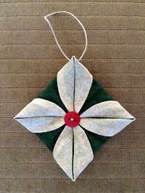 a green and white ornament hanging on a wall