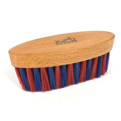 a wooden brush with red, white and blue bristles on it's head