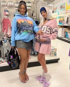 two women standing next to each other in a store