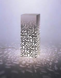 a light that is on in the middle of some kind of flooring material with numbers all over it