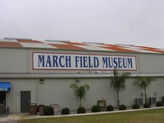 a large sign on the side of a building that says march field museum in front of it