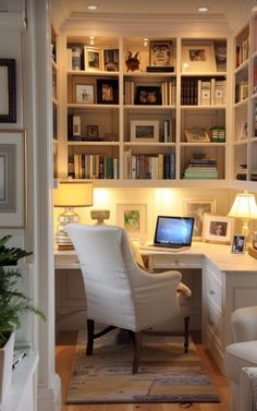 a home office with built - in bookshelves, desk and chair is shown