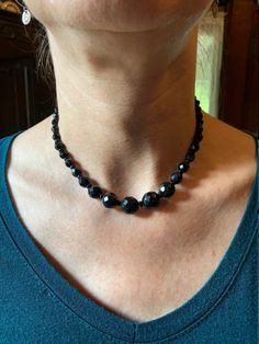 Tapered, 15" necklace of black Onyx. This vintage string of faceted beads is in beautiful condition. Looks to be mid-century. Black Faceted Beads Costume Jewelry Necklace, Vintage Black Beaded Necklace With Large Beads, Vintage Black Gemstone Beads Necklace, Vintage Black Beaded Necklace With Gemstone Beads, Formal Black Beaded Necklace With Faceted Beads, Formal Black Faceted Beaded Necklaces, Formal Black Faceted Beaded Necklace, Adjustable Black Vintage Beaded Necklace, Onyx Necklace With Faceted Round Beads