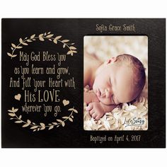 a black and gold frame with an image of a baby