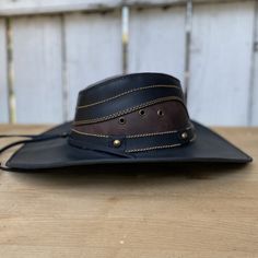 The price INCLUDES sales taxes and SHIPPING costs within the United States
This authentic leather hat, with its distinctive design and a star on the hat band, is a must-have accessory for a unique style. With a 3" brim and 4" crown, this black hat includes an adjustable drawstring for the perfect fit. Made 100% in Mexico, it is ideal for those looking for a quality leather hat with a touch of distinctive character.
Description of the Hat:
Because this hat is made of 100% genuine leather, the col Adjustable Leather Fedora With Short Brim, Leather Fedora Hats For Rodeo, Leather Brimmed Fedora For Rodeo, Western Leather Fedora With Flat Brim, Western Style Leather Fedora With Flat Brim, Leather Fedora For Rodeo With Short Brim, Adjustable Leather Fedora, Western Hats With Leather Lining And Flat Brim, Vintage Leather Hat For Western-themed Events