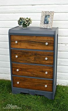 an old dresser has been painted with dark brown paint and silver knobs on the drawers