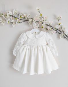 ♡ This is handmade and unique baby girl dress below knee-length and with long sleeves.     The dress consists of a lace top finished with a delicate collar and a beautiful skirt. ♡ MADE OF: Ecru fabric with the same colour lace. The lining is made of 100% cotton. ♡ Processing time is usually 5-7 days.  ♡ CARE INSTRUCTIONS: Wash in cold or warm water (30oC/ 65 - 85F). Do not use bleach. Dry at low temperatures, do not use machine drying. Iron at medium or low temperature. Hand wash and hang dry for longer wear. White Fitted Lace Dress For Dress-up, Long Sleeve Dresses For First Communion In Spring, Fitted Long Sleeve Baptism Dress, Fitted White Lace Dress For Dress-up, White Fitted Princess Lace Dress, Spring White Long Sleeve Wedding Dress, Long Sleeve Cream Dress For Baptism, Princess Style Cream Dress With Lace Trim, Princess Style Long Sleeve Cream Dress