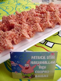 rice krispy treats are on a plate with a card next to it and an image of peppa pig