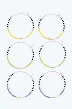 Our neon beaded hoop celebrates the fun, vibrant colors of the season. These pieces are perfect for a summer party or cook-out. They add a "pop" of color to any outfit! These lightweight, gold filled hoops are made with gold, white, black, and your choice of neon green, orange, yellow, purple, or pink beads. Multicolor Hoop Earrings For Summer, Fun Gold Jewelry For Summer, Fun Gold Summer Jewelry, Trendy Summer Hoop Earrings, Trendy Hoop Earrings For Spring Beach Events, Trendy Hoop Earrings For Beach In Spring, Trendy Hoop Earrings With Tiny Beads, Gold Hoop Earrings With Tiny Beads For Summer, Summer Hoop Earrings With Colorful Beads