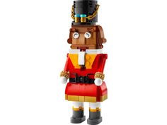 a lego toy is made to look like a nutcracker wearing a red and yellow outfit