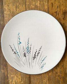 a white plate with blue flowers on it