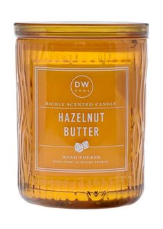 a jar of honey scented candle with the label hazelnut butter