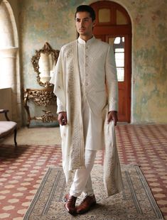 Off-white embroidered fabric prince coat with kurta pajama. Elevate your attire with a custom Nehru jacket, perfect for cultural events, festivals, and parties. Complete your groomsmen's attire with a Nehru jacket and sherwani ensemble.In the world of men's formal wear, the off-white prince coat emerges as a beacon of refined elegance, crafted meticulously from a blend of luxurious cotton fabrics. Its pristine hue, reminiscent of purity and sophistication, sets the stage for a distinguished aest Prince Coat, Geometric Diamond Pattern, Indian Party Wear, Mens Formal Wear, Kurta Pajama, Nehru Jackets, Mens Formal, Embroidered Fabric, Coat Design