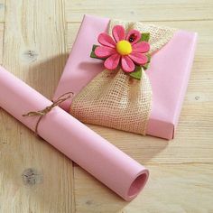 a pink wrapping paper with a flower on it