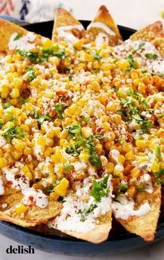 corn and cheese nachos in a blue dish