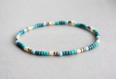 Beige, Turquoise, Teal, Grey & Gold Bracelet Mixed Beads I can make the bracelet to your size.  Just send me a message or you will receive a standard size (18cm) bracelet. Teal Beaded Bracelets, Teal Bracelet, Small Beads, Teal And Grey, Bracelet Boho, Personalized Bracelets, Boho Bracelets, Clay Beads, Grey And Gold