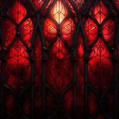 a red stained glass window with an intricate design