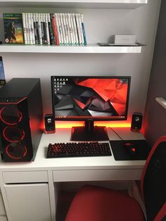 a desk with a computer and speakers on it