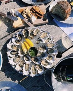 there is a platter of oysters on the table