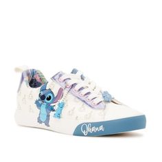 These Cute Sneakers Include Fan Favorite, Stitch, Blue Glitter And A Tropical Inner Print To Add A Pop Of Color To Your Outfit. Includes A Removable Keychain With The Silhouette Of Lilo's Doll Scrump To Match The Allover Scrump Print On The Sides. Bonus: An Adorable Hibiscus Flower Lace Charm Sits At The Front For Extra Flair. Shoe Closure: Lace-Up Materials: Manmade Upper End Use: Casual Silhouette For Everyday Wear Clean & Care: Wipe Clean With Damp Cloth Features: Fun Prints; Blue Glitter Det Synthetic Sneakers With Character Print And Round Toe, Disney Low-top Sneakers With Rubber Sole, Disney Character Print Sneakers With Round Toe, Cute Low-top Sneakers With Vulcanized Sole, Cute Low-top Synthetic Sneakers, Blue Lace-up Synthetic Canvas Shoes, Casual Low-top Sneakers With Character Print, Cute Slip-on Synthetic Sneakers, Cute Synthetic Slip-on Sneakers