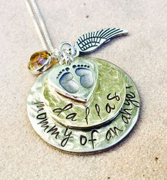 Memorial Necklace- Mommy Of An Angel * one inch hand stamped disc- hammered * 3/4 inch name date disc- hammered * sterling baby foot print charm * silver angel wing * sterling chain * birthstone * free gift wrap Just convo me to add a birthstone or initials to this design. Please visit more of my shop designs here http://www.etsy.com/shop/natashaaloha Personalized Jewelry For Memorial, Personalized Round Disc Jewelry For Memorial, Adjustable Hand Stamped Jewelry For Memorial, Hand Stamped Round Memorial Jewelry, Anniversary Hand Stamped Round Disc Charm Necklaces, Hand Stamped Memorial Jewelry, Memorial Hand Stamped Round Pendant Necklaces, Memorial Hand Stamped Round Pendant Necklace, Round Hand Stamped Memorial Necklaces