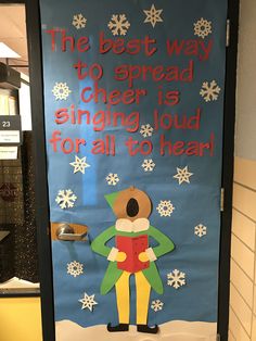 a door decorated with a christmas theme and the words, the best way to spread cheer is singing loud for all to hear